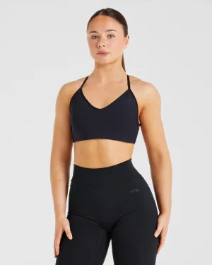 Essential Crossback Sports Bra - Black Bright Hook-and-eye closure seams