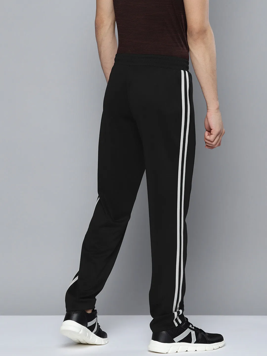 UV protection coating Bootcut shape Alcis Men Black Solid Track Pants