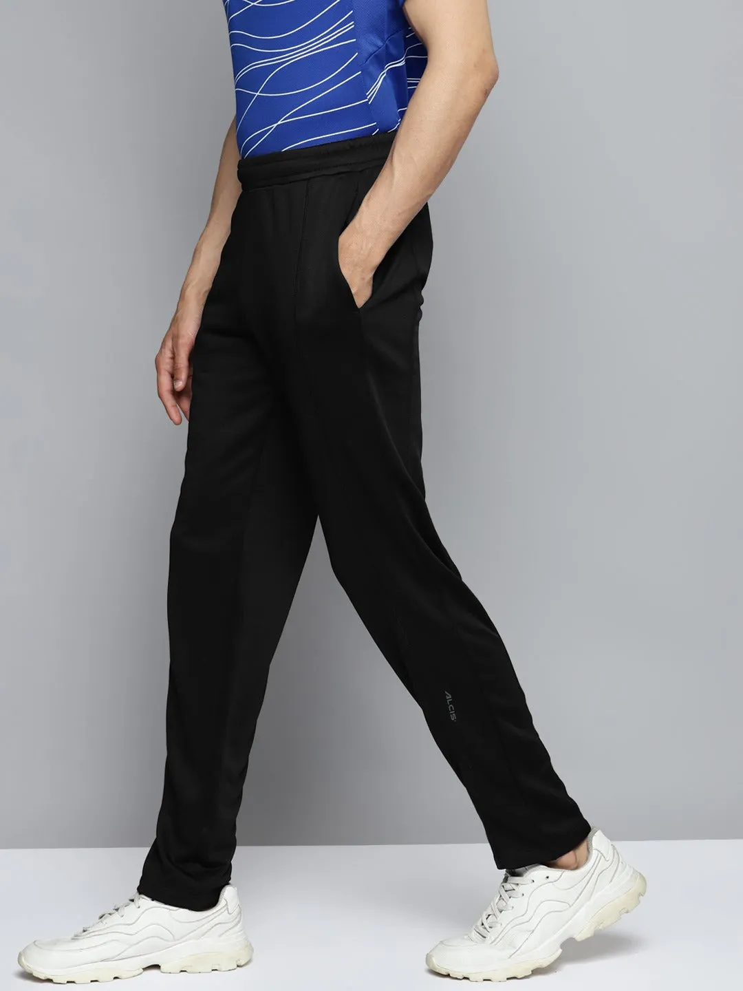 Alcis Men Black Solid Slim Fit Mid-Rise Regular Track Pants DoubleLayeredKnees