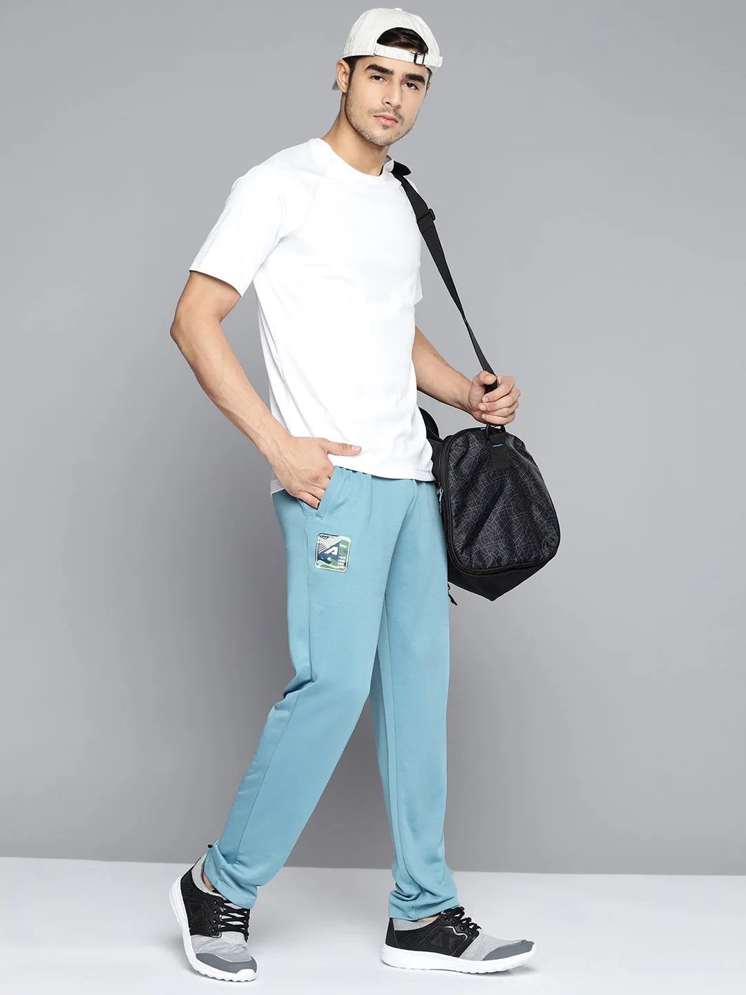 NonRestrictiveFit Alcis Men Blue Solid Slim Fit Track Pants