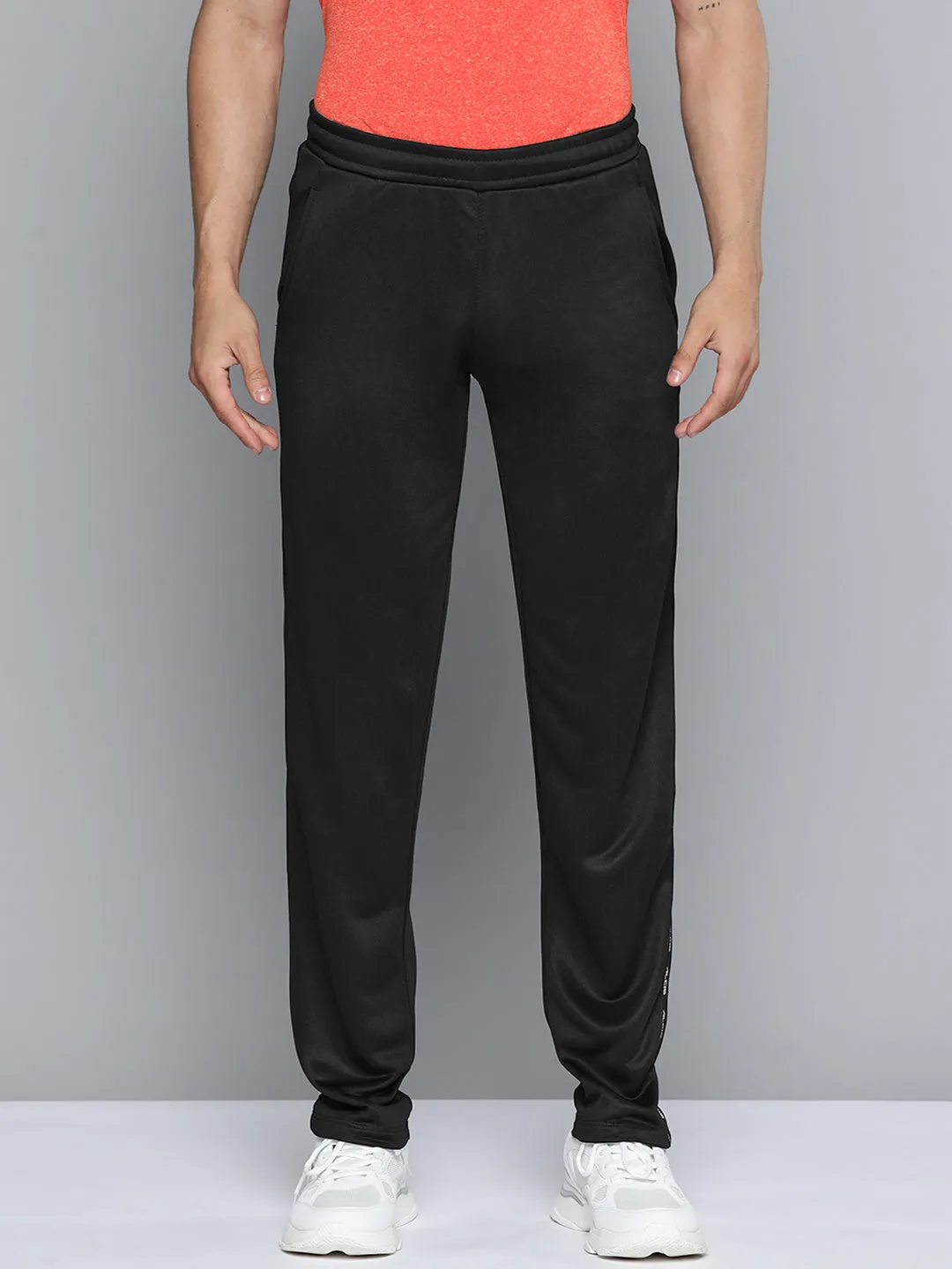 Alcis Men Black Solid Track Pants Dynamic Flex Panels Street Style