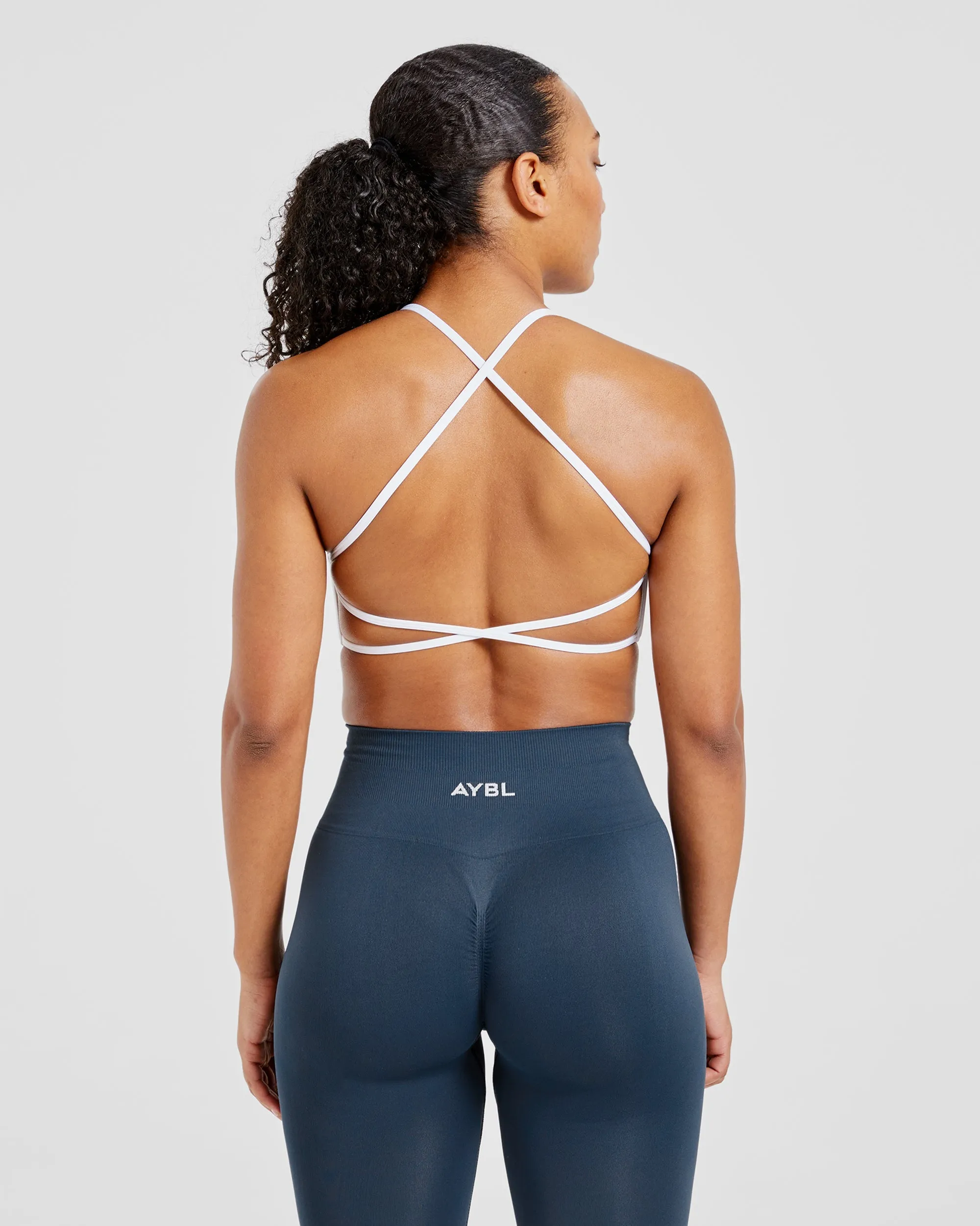 Wear under clothes seams Indoor workout clothes Essential Crossback Sports Bra - White