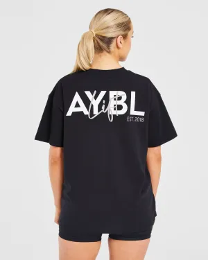 Flexible Joint Paneling Lift Graphic Oversized T Shirt - Black Bi Stretch Fabric