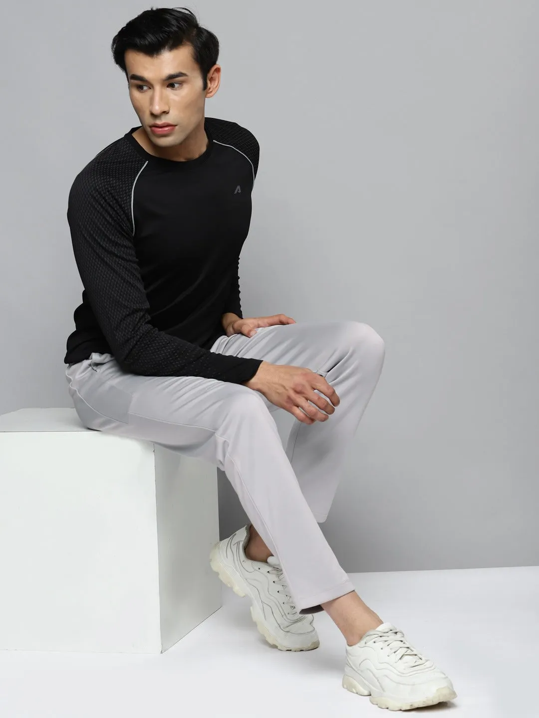 Alcis Men Grey Solid Slim Fit Mid-Rise Regular Track Pants Carbon Infused Fabric Multi Panel Construction