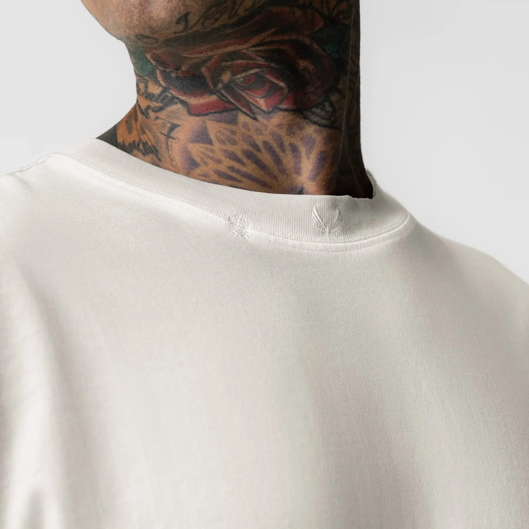 0797. Tech Essential? Relaxed Tee - Faded Stone Pocket Detailing