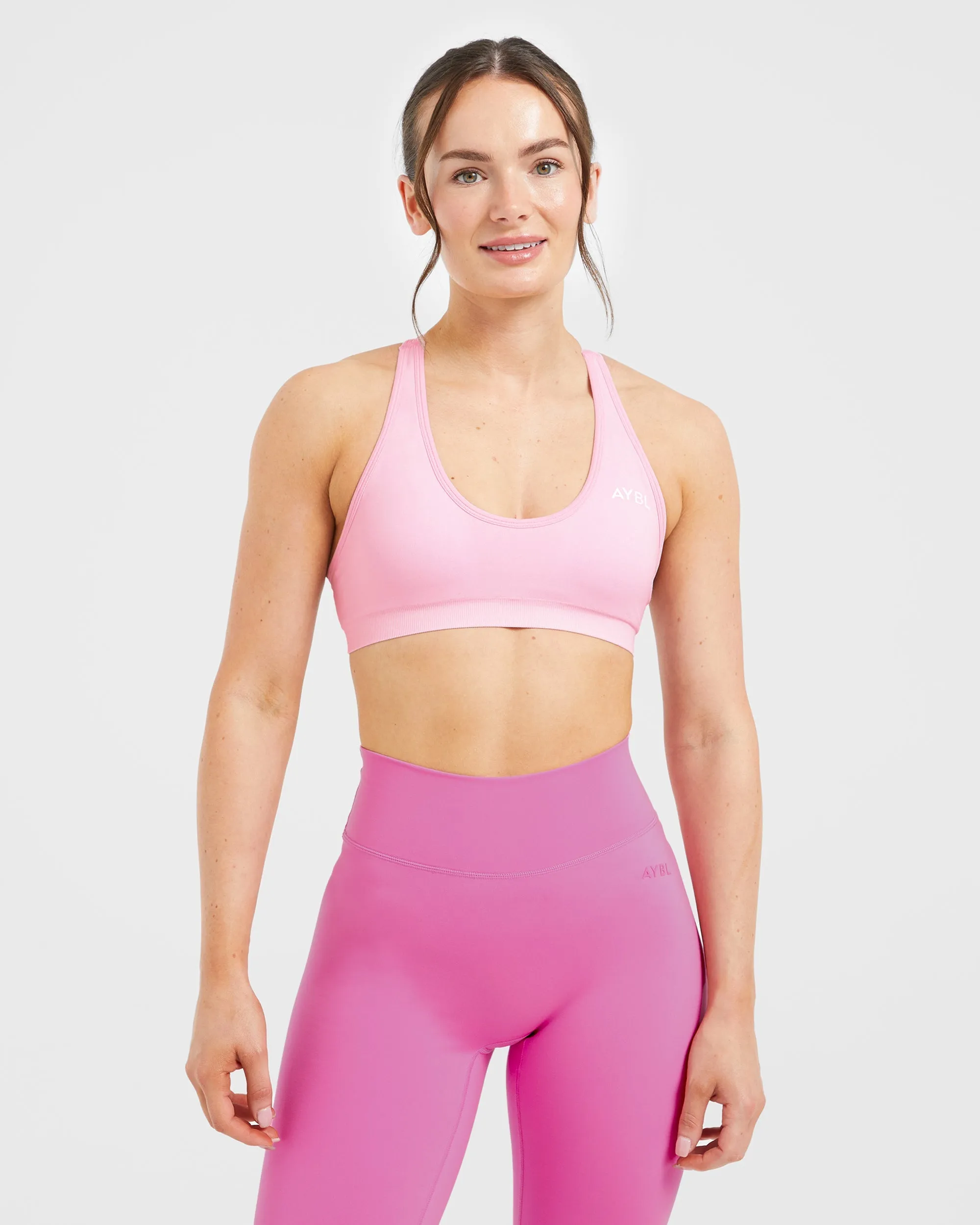 Sewn seams Essential Seamless Racer Back Sports Bra - Baby Pink