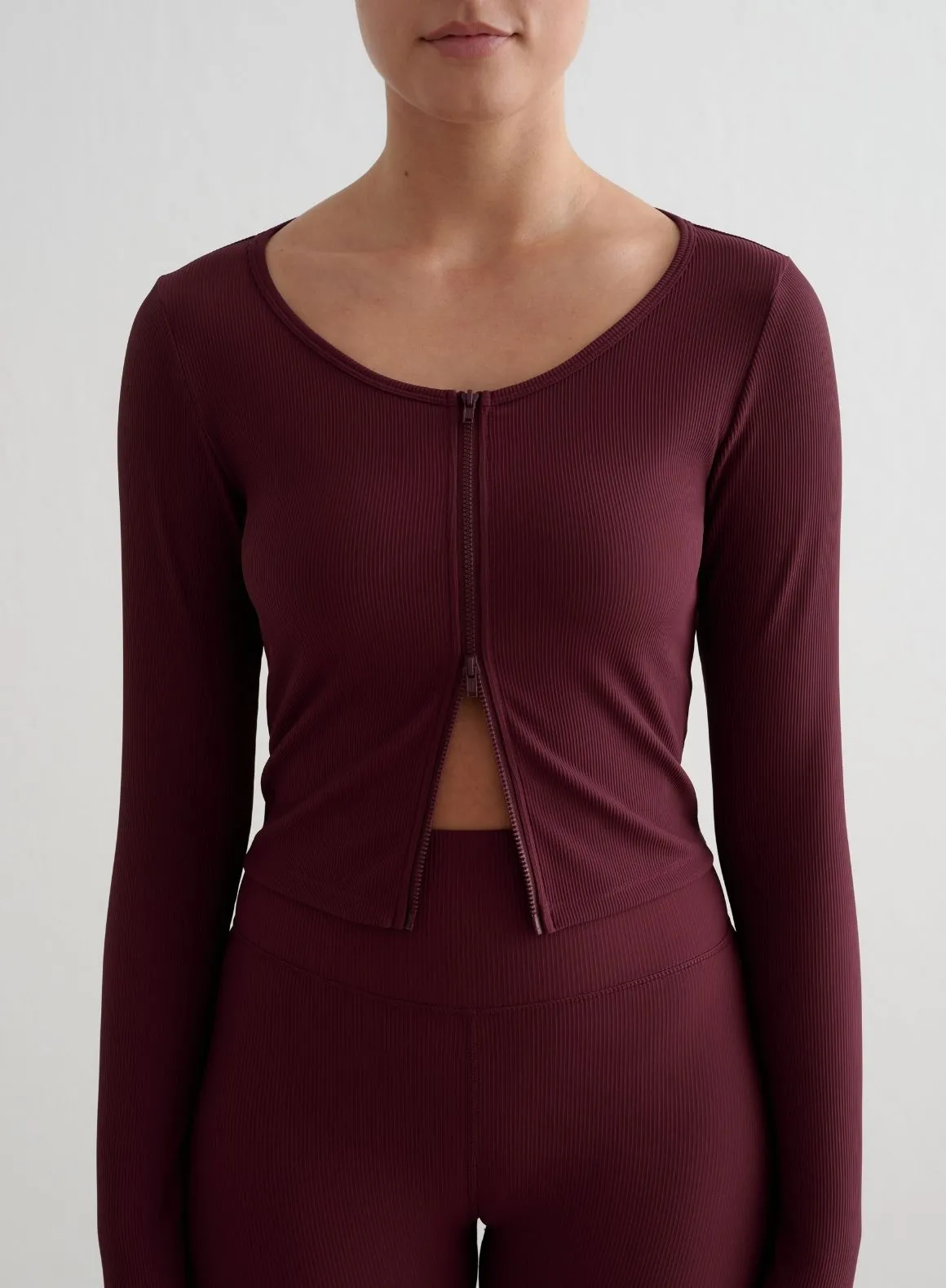 Cherry Ribbed Performance Zipped Cardigan shopper Studying