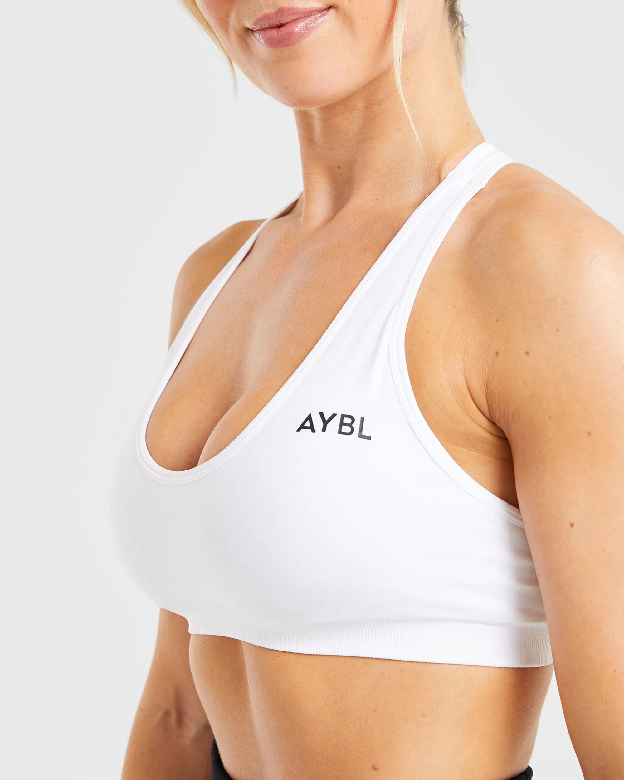 Essential Seamless Racer Back Sports Bra - White Embroidered seams