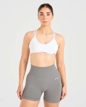 Non-Restrictive Support Mock neck seams Essential Strappy Sports Bra - White