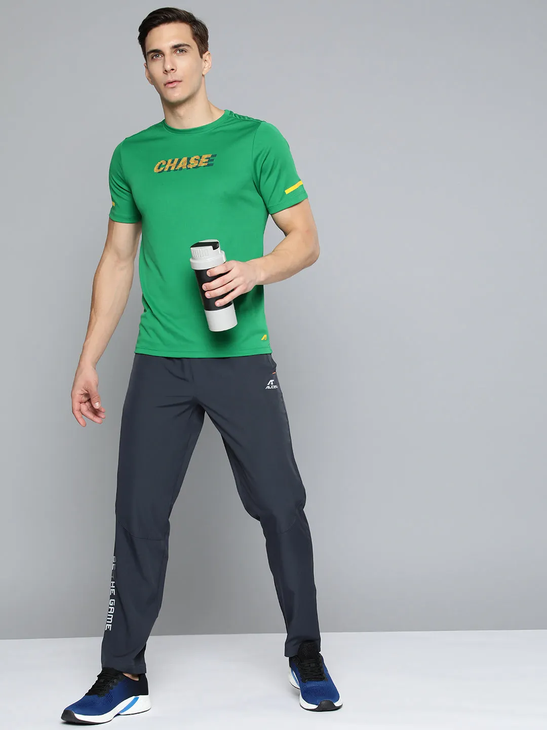 Skin Hug Alcis Men Green Yellow Typography Printed Slim Fit Running T-shirt