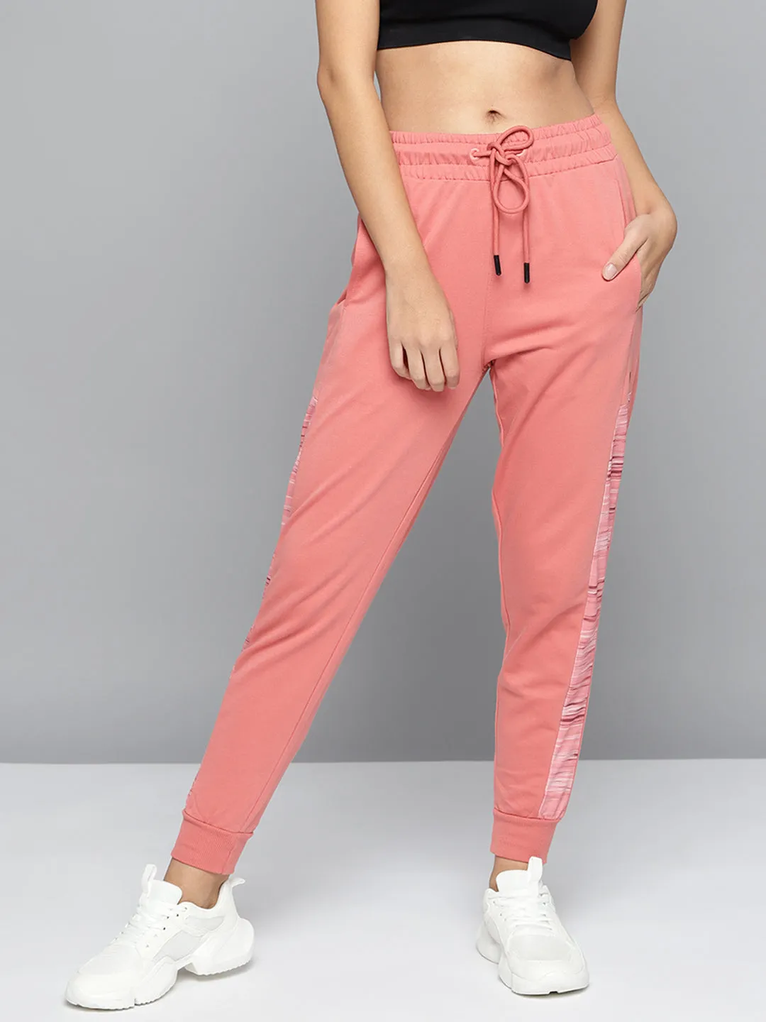 Windproof coating Alcis Women Peach-Coloured Solid Slim-Fit Training Joggers with Side Taping