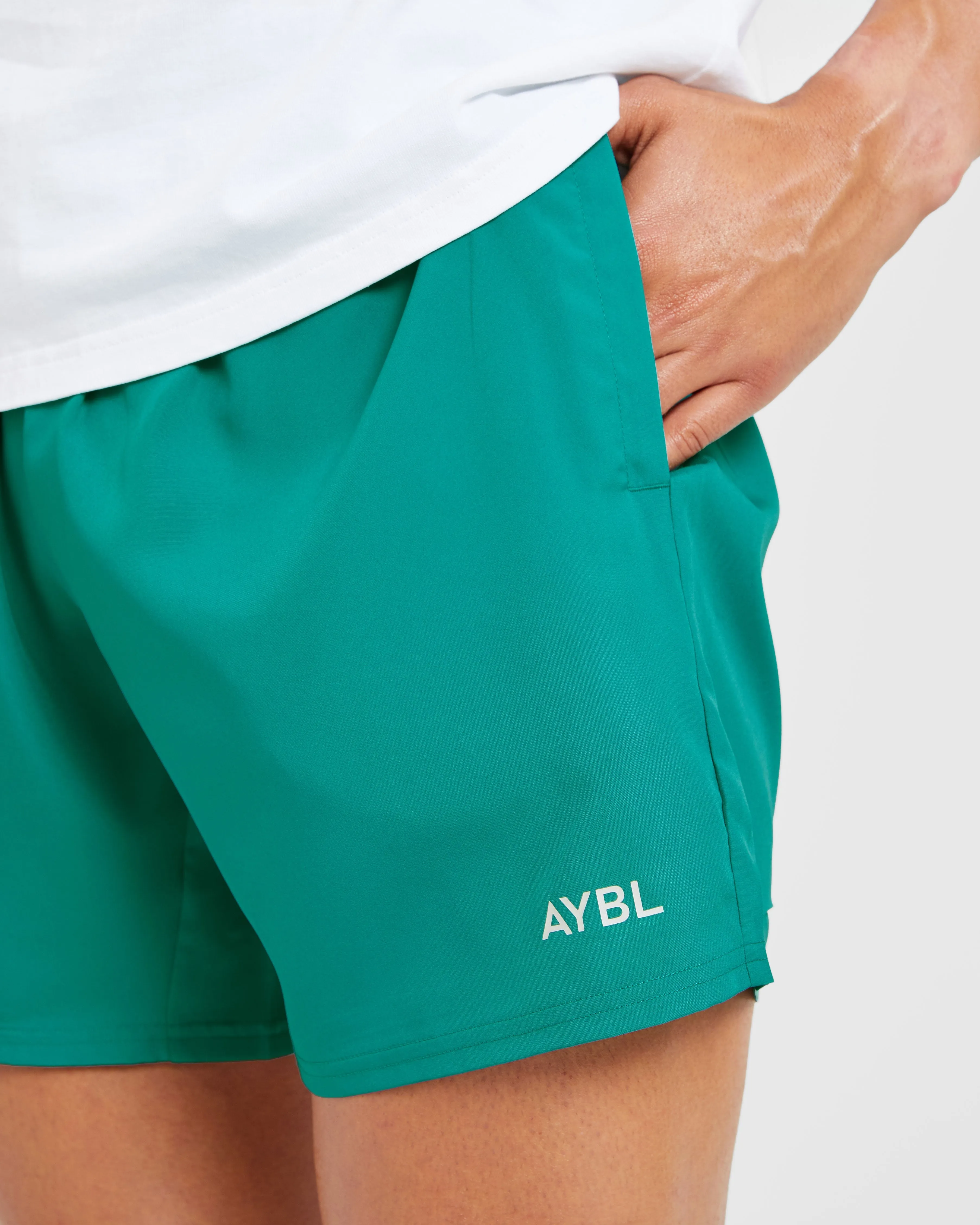 Light Stretch Laser Cut Edges Core 5" Shorts - Teal