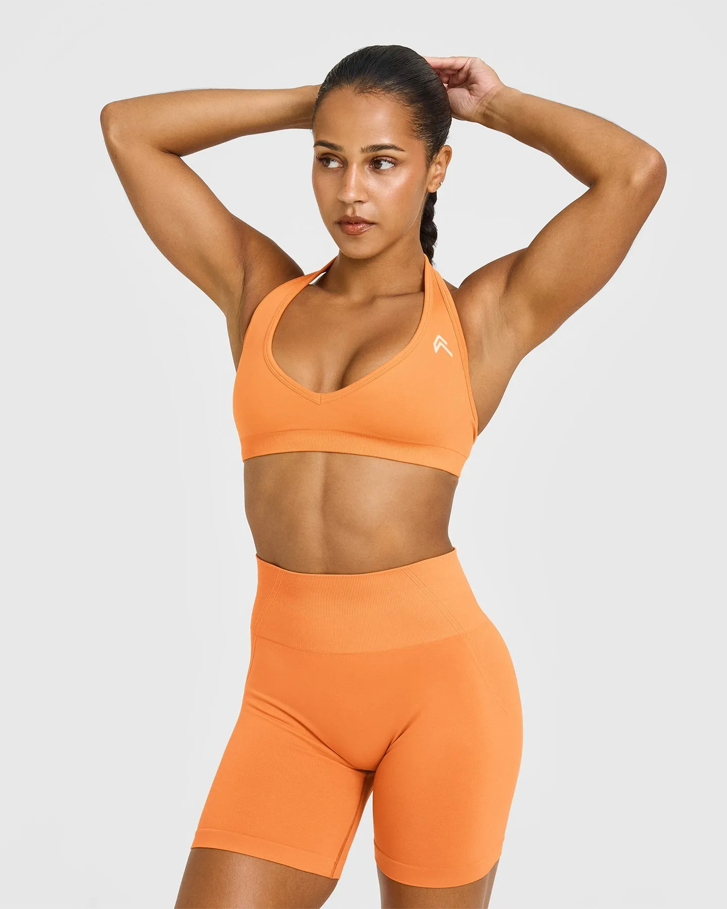 Pact Effortless Seamless Halter Neck Sports Bra | Apricot Orange High Neck