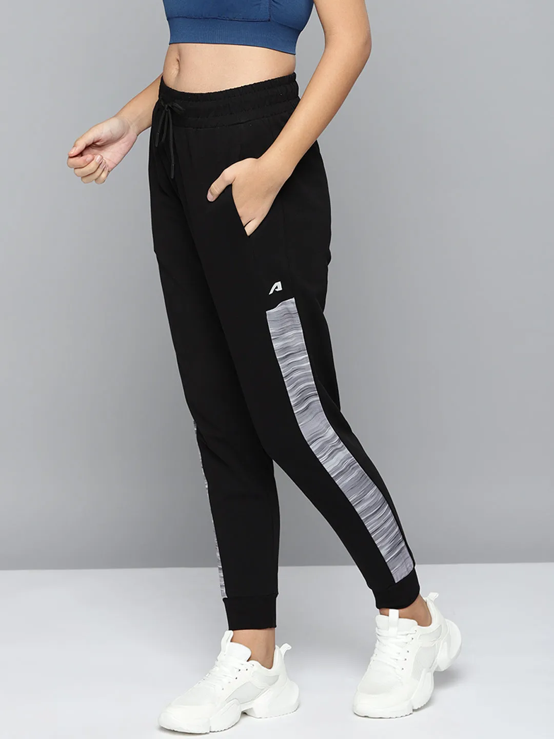 Alcis Women Black Solid Slim-Fit Training Joggers with Side Taping Low Bulk Material