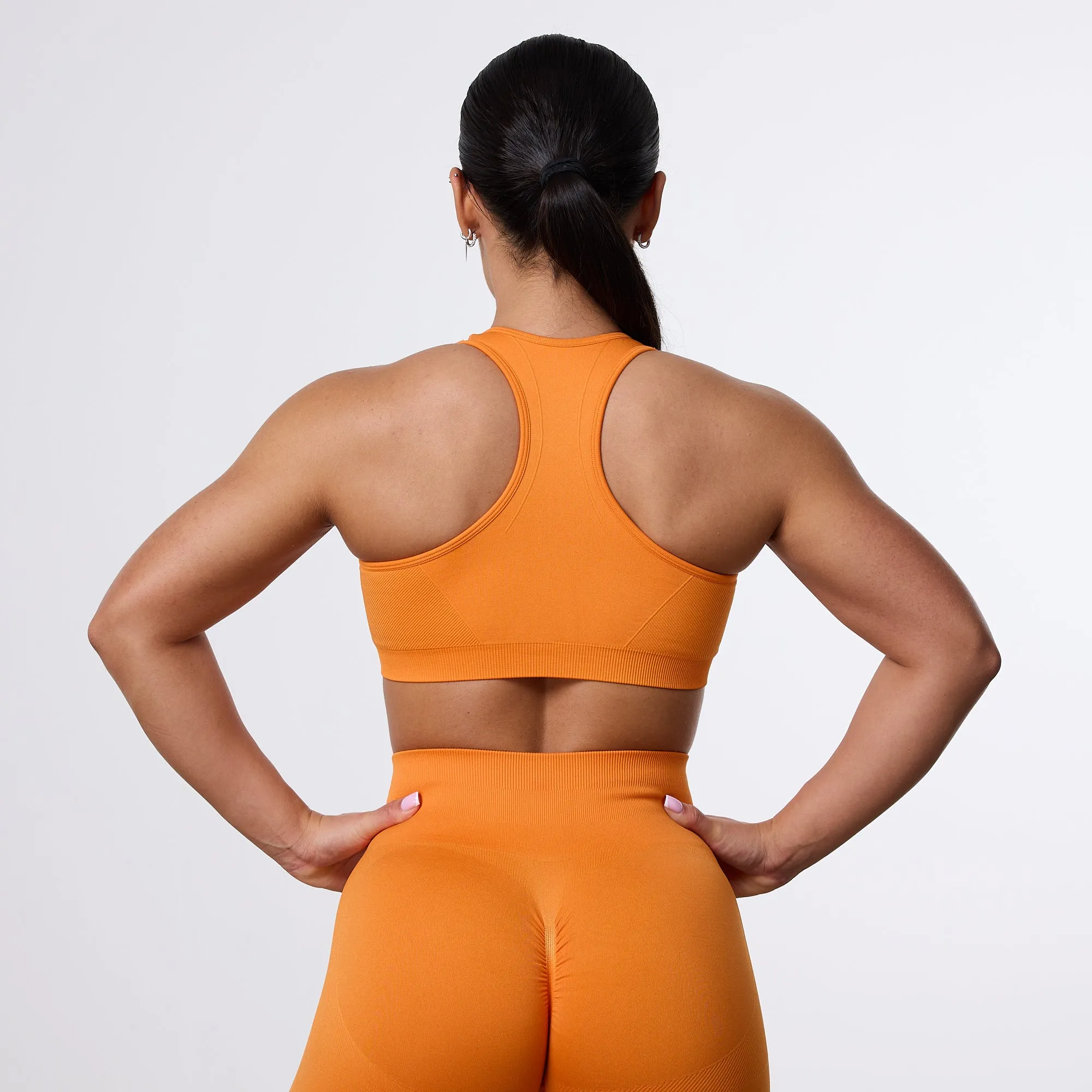 Vanquish Elevate Seamless Orange Support Bra Post Workout Recovery Design Hidden stitching seams